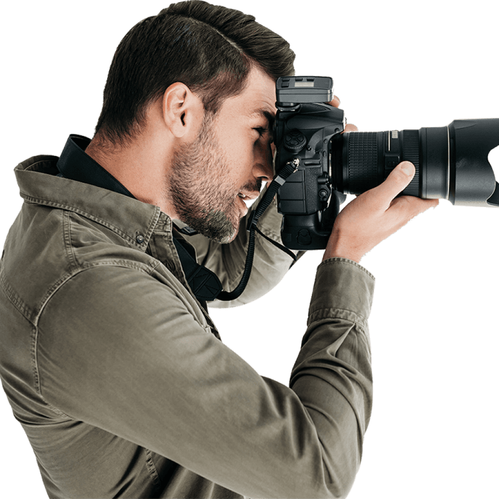 Un homme photographe avec un appareil photo